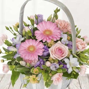 A basket of mixed flowers and foliage.