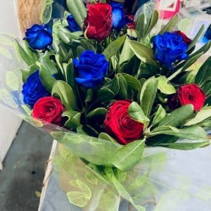 Beautiful Mother's Day Blue and Red Roses arrangement carefully arranged by Little Flower Shop in Burgess Hill for your mother to enjoy on her special day